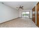Expansive main bedroom with neutral carpet, ceiling fan and a sliding glass door with lake view at 3136 River Bay N Dr, Indianapolis, IN 46240