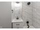 Bathroom featuring a marble tiled shower with a rain shower head and a quartz countertop vanity at 3180 Graceland Ave, Indianapolis, IN 46208
