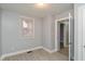 Bedroom with light gray paint, window, and light-colored flooring at 3180 Graceland Ave, Indianapolis, IN 46208