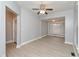 Bright living room featuring grey walls, white trim, new laminate flooring, and a ceiling fan at 3180 Graceland Ave, Indianapolis, IN 46208
