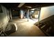 Unfinished basement featuring concrete floors, utility appliances, and exposed ducts at 324 E Southern Ave, Indianapolis, IN 46225