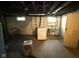 Unfinished basement area with washer, dryer, and utility sink at 324 E Southern Ave, Indianapolis, IN 46225