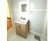 Bathroom featuring a stylish vanity with modern marble countertop and sleek mirror at 324 E Southern Ave, Indianapolis, IN 46225