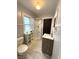 Bathroom featuring new shower, vanity, and toilet, along with modern fixtures at 324 E Southern Ave, Indianapolis, IN 46225