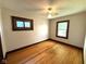 Cozy bedroom with natural light, hardwood flooring, and neutral walls at 324 E Southern Ave, Indianapolis, IN 46225
