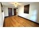 Bright bedroom with hardwood floors, ceiling fan, and neutral paint at 324 E Southern Ave, Indianapolis, IN 46225