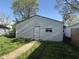 Detached garage with siding and a door; a functional outdoor space at 324 E Southern Ave, Indianapolis, IN 46225