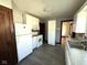 Kitchen featuring cabinets and appliances, with doorway access to an adjacent room at 324 E Southern Ave, Indianapolis, IN 46225