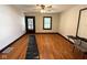 Bright living room with hardwood floors and neutral paint; features a ceiling fan at 324 E Southern Ave, Indianapolis, IN 46225