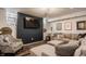 Finished basement features a comfortable seating area with a large TV and sports memorabilia at 4134 N Pennsylvania St, Indianapolis, IN 46205