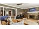 Open concept living area showcasing a fireplace, stairway, and hardwood floors at 4134 N Pennsylvania St, Indianapolis, IN 46205
