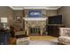 Fireplace and seating in a living room with hardwood floors and natural light at 4134 N Pennsylvania St, Indianapolis, IN 46205