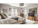 Serene main bedroom with soft natural light, neutral tones and hardwood flooring at 4134 N Pennsylvania St, Indianapolis, IN 46205