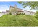 Spacious backyard with a pergola, lush lawn, and mature trees at 4264 Amesbury Pl, Noblesville, IN 46062