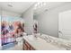 Bathroom with a palm tree shower curtain and a single vanity at 4264 Amesbury Pl, Noblesville, IN 46062