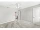 Neutral bedroom featuring carpeted floors, a ceiling fan and two entry doors at 4264 Amesbury Pl, Noblesville, IN 46062