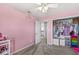 Pink bedroom featuring an open closet and neutral carpeted floors at 4264 Amesbury Pl, Noblesville, IN 46062