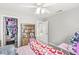 Bedroom with a ceiling fan, carpeted floors, and a closet at 4264 Amesbury Pl, Noblesville, IN 46062