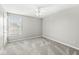 Empty bedroom with a ceiling fan and carpeted floors at 4264 Amesbury Pl, Noblesville, IN 46062