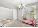 Bright entryway with carpet floors, a chandelier, and a view of the front door at 4264 Amesbury Pl, Noblesville, IN 46062