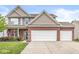 Charming two-story brick home with a two-car garage and manicured landscaping at 4264 Amesbury Pl, Noblesville, IN 46062