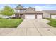 Two-story home with three car garage and spacious driveway at 4264 Amesbury Pl, Noblesville, IN 46062