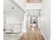 Hallway with hardwood floors and view of dining room at 4264 Amesbury Pl, Noblesville, IN 46062