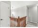This hallway features wood railings and access to multiple rooms at 4264 Amesbury Pl, Noblesville, IN 46062