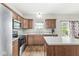 Bright kitchen with wood floors, stainless steel appliances, and a center island at 4264 Amesbury Pl, Noblesville, IN 46062