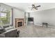 The living room features a fireplace, ceiling fan and lots of natural light at 4264 Amesbury Pl, Noblesville, IN 46062