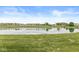 Scenic pond surrounded by lush green grass, offering a peaceful view at 4264 Amesbury Pl, Noblesville, IN 46062