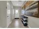 Inviting entryway with hardwood floors, white trim, a front door with glass, and stylish decorations at 4530 Laughter Ln, Indianapolis, IN 46235