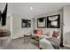 Comfortable living room featuring a sectional sofa, modern decor, and a wall-mounted TV at 4530 Laughter Ln, Indianapolis, IN 46235