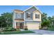 Charming two-story home with a welcoming entrance, attached garage, and manicured front lawn at 4542 Laughter Ln, Indianapolis, IN 46235