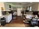 Functional kitchen featuring gray cabinets, white appliances, dark countertops and wood-look flooring at 4711 Earlham Dr, Indianapolis, IN 46227