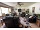 Inviting living room showcasing hardwood floors, a ceiling fan, a comfortable sofa, and natural light at 4711 Earlham Dr, Indianapolis, IN 46227