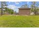 View of expansive backyard with lush green grass and mature trees, offering ample space for outdoor activities at 5168 E Walnut Dr, Mooresville, IN 46158