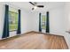 Spacious bedroom with natural light, hardwood floors, and bright white walls at 5168 E Walnut Dr, Mooresville, IN 46158