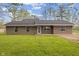Charming single story brick home with a manicured green lawn and tidy landscaping at 5168 E Walnut Dr, Mooresville, IN 46158