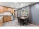 Well-lit kitchen featuring wood cabinets, stainless steel appliances, and a cozy dining area at 5168 E Walnut Dr, Mooresville, IN 46158