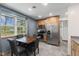 Charming kitchen featuring wood cabinets, stainless steel appliances, and a bright window at 5168 E Walnut Dr, Mooresville, IN 46158