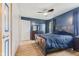 Spacious main bedroom featuring a ceiling fan, wood flooring, and large windows at 5168 E Walnut Dr, Mooresville, IN 46158