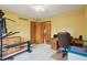 Spacious bedroom with neutral carpet, exercise equipment, and ample closet space at 524 Deerberry Dr, Noblesville, IN 46062