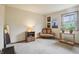 Bright bedroom with a window, artwork, settee, and side table, offering a cozy retreat at 524 Deerberry Dr, Noblesville, IN 46062