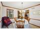 Cozy dining room with a charming light fixture, a window, and elegant decor at 524 Deerberry Dr, Noblesville, IN 46062