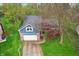 Aerial view of a beautiful blue house with a well-maintained lawn and mature trees at 524 Deerberry Dr, Noblesville, IN 46062