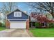 Charming two-story blue home with brick accents, a two-car garage, and a well-manicured lawn at 524 Deerberry Dr, Noblesville, IN 46062