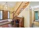 Grand foyer with wooden staircase, tile entryway, and lovely decor at 524 Deerberry Dr, Noblesville, IN 46062