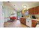 Well-lit eat-in kitchen with matching appliances, a window over the sink, and access to patio at 524 Deerberry Dr, Noblesville, IN 46062
