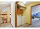 Functional laundry area with washer, dryer, and storage, conveniently located near the staircase and upstairs living space at 524 Deerberry Dr, Noblesville, IN 46062